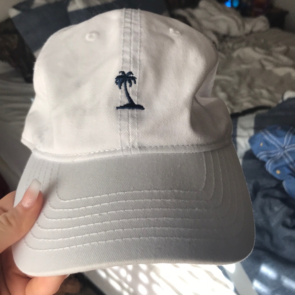 White hat with palm tree